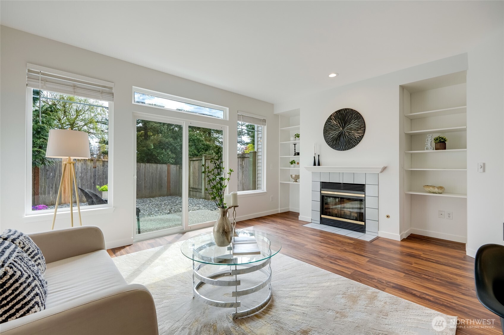 23908 Bothell Everett Highway, Unit C4 Bothell, WA 98021 - Photo 11 of 33 a living room with furniture a fireplace and a large window