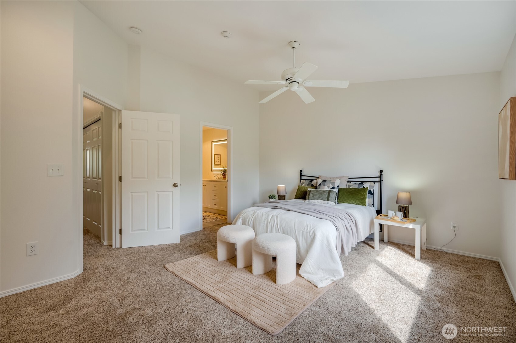 23908 Bothell Everett Highway, Unit C4 Bothell, WA 98021 - Photo 17 of 33 a bedroom with a bed and a chandelier