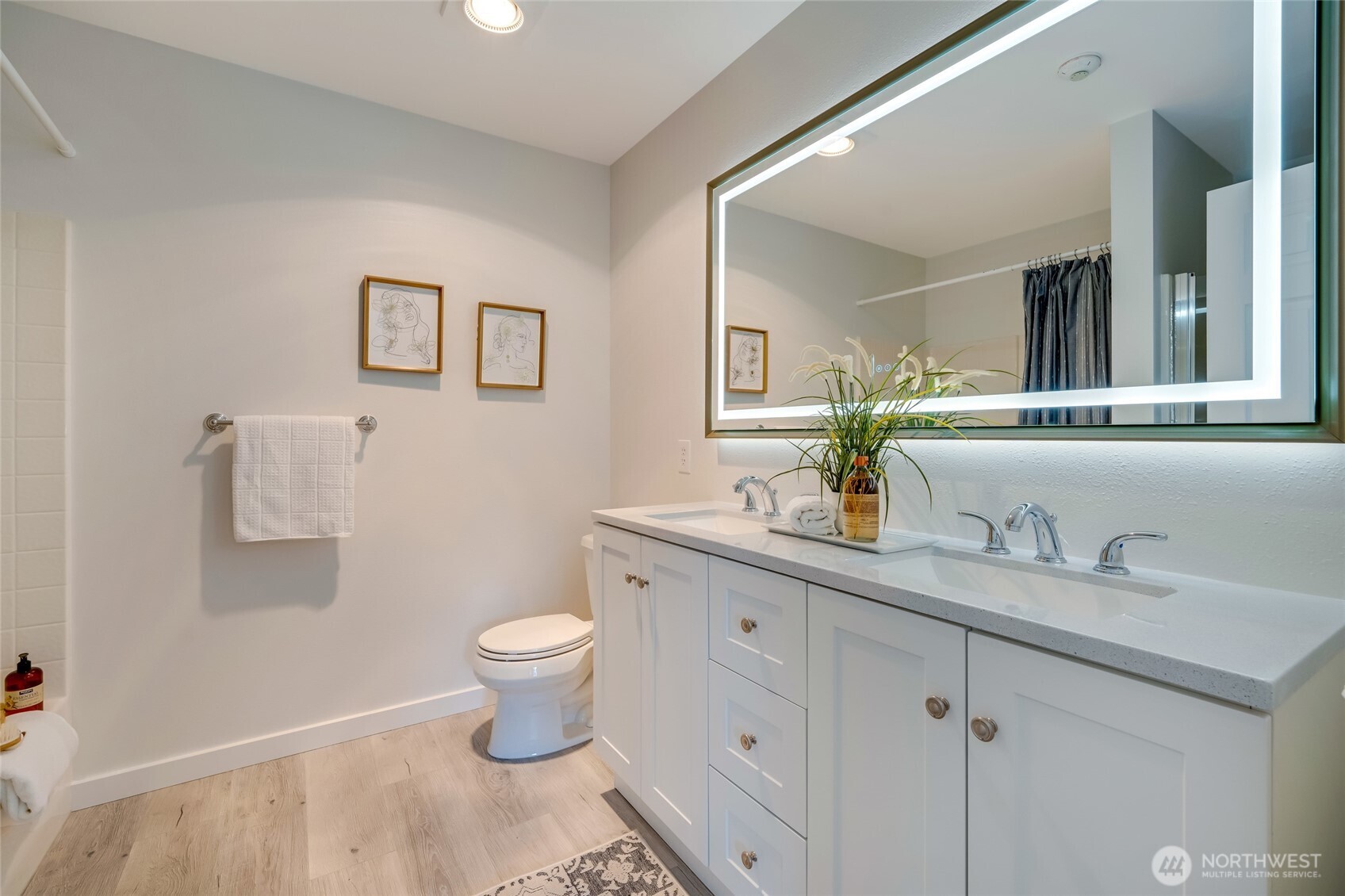 23908 Bothell Everett Highway, Unit C4 Bothell, WA 98021 - Photo 18 of 33 a bathroom with a granite countertop sink a toilet and a mirror