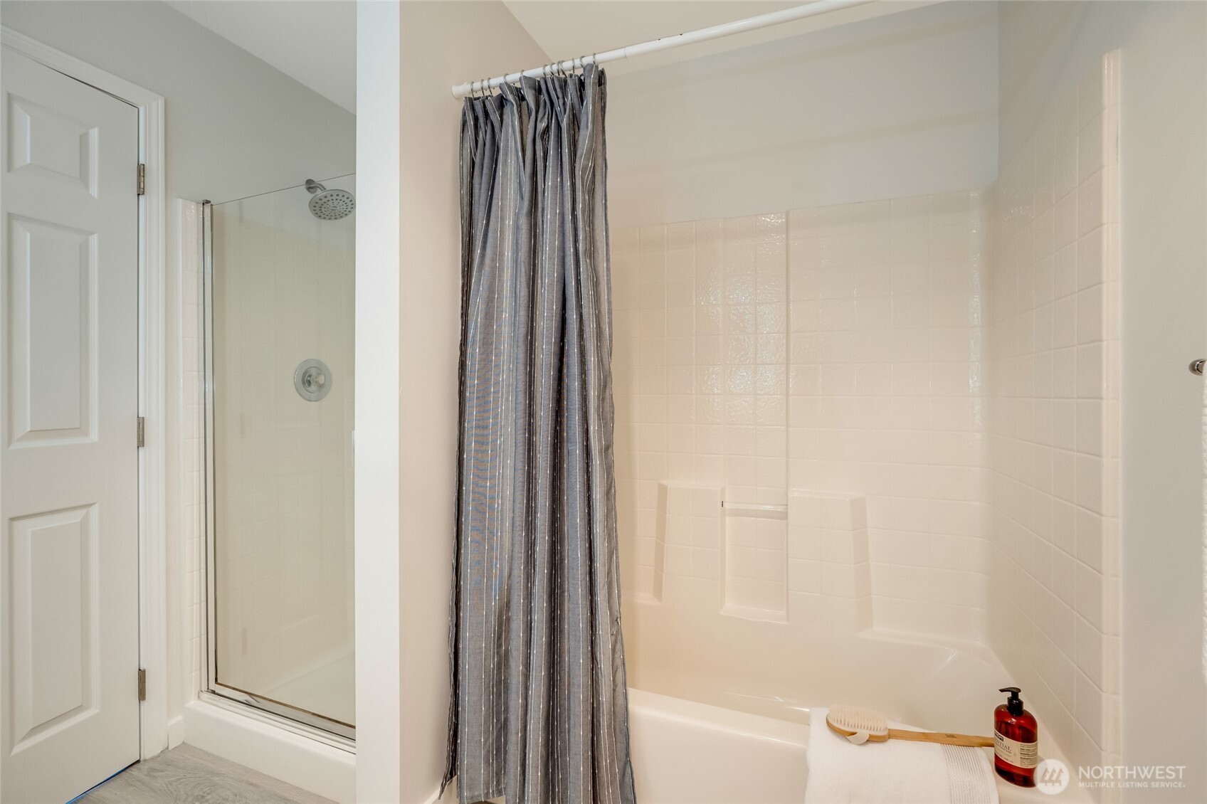 23908 Bothell Everett Highway, Unit C4 Bothell, WA 98021 - Photo 19 of 33 a bathroom with a bathtub and a shower