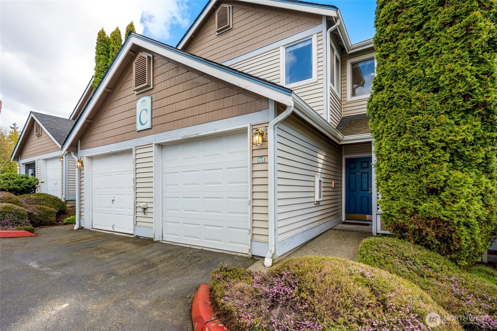 23908 Bothell Everett Highway, Unit C4 Bothell, WA 98021 - Photo 2 of 33 a view of a house with a garage