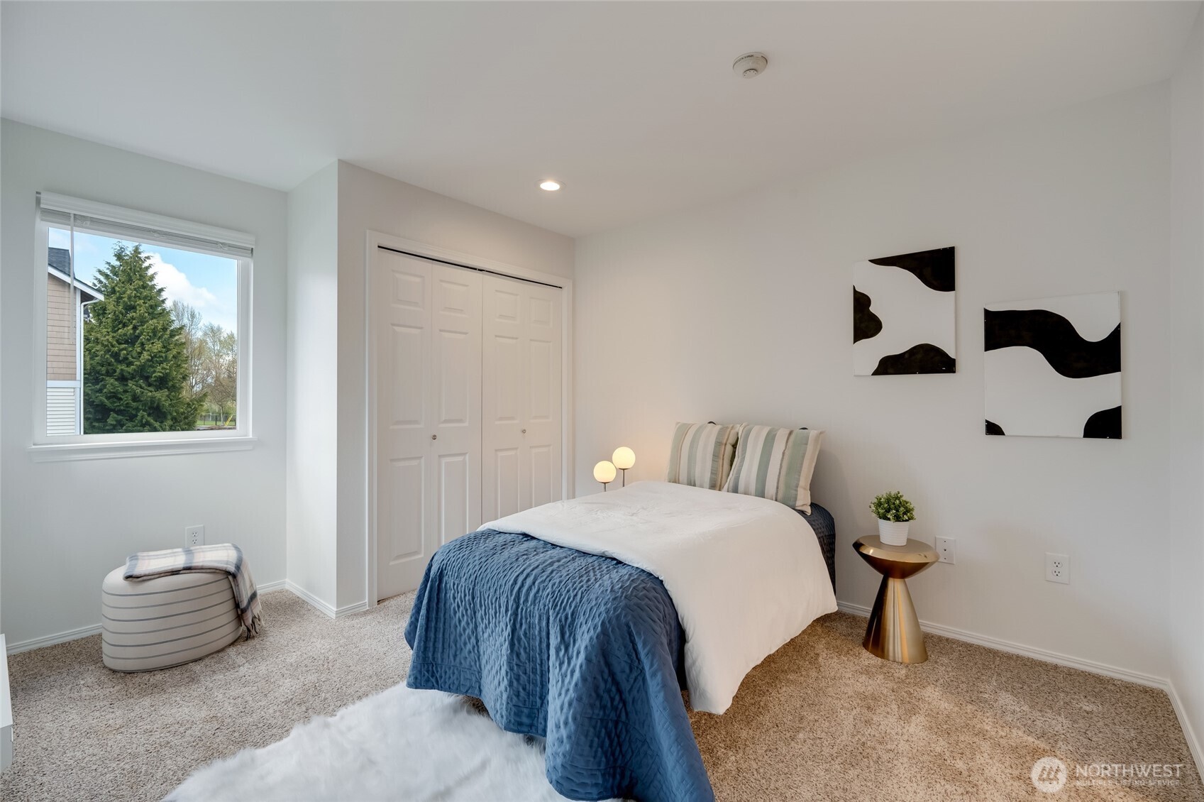 23908 Bothell Everett Highway, Unit C4 Bothell, WA 98021 - Photo 23 of 33 a bedroom with a bed and a painting on the wall