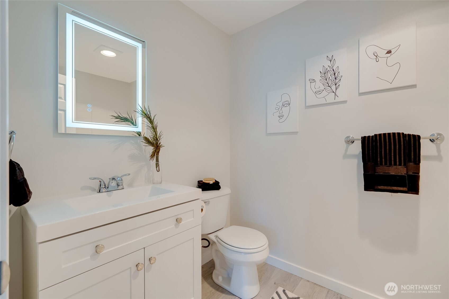23908 Bothell Everett Highway, Unit C4 Bothell, WA 98021 - Photo 24 of 33 a bathroom with a sink a toilet and a mirror