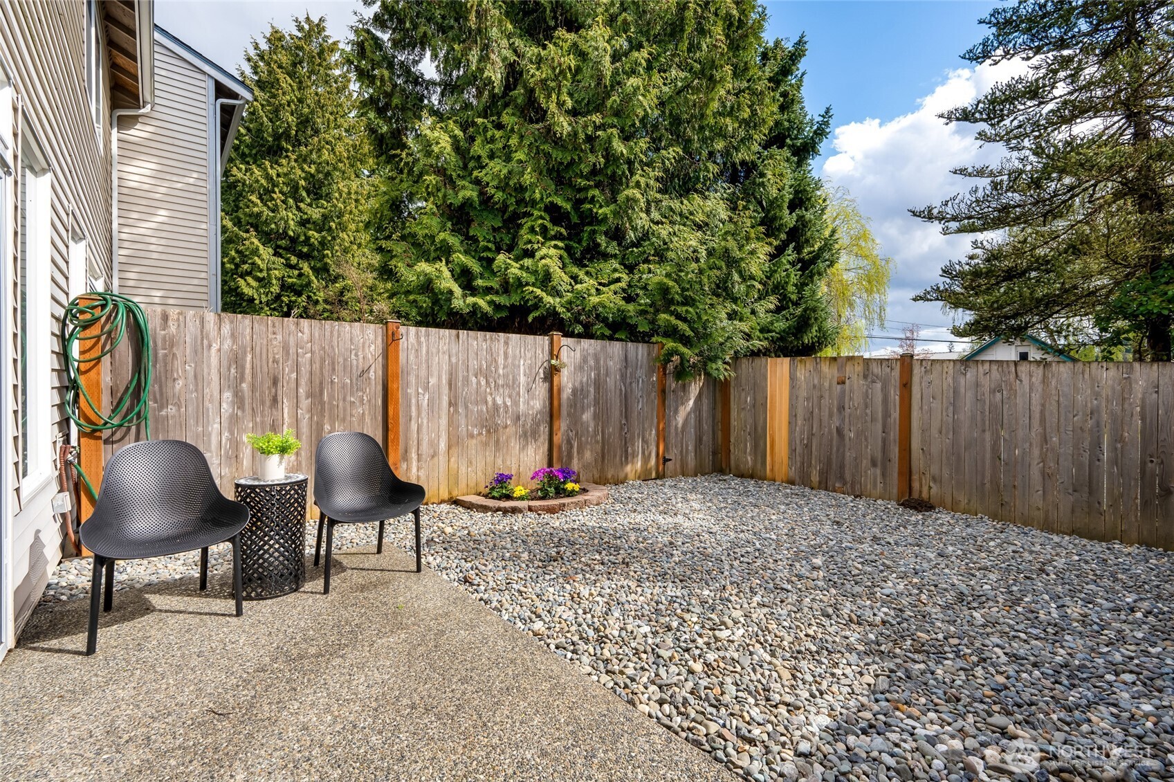 23908 Bothell Everett Highway, Unit C4 Bothell, WA 98021 - Photo 26 of 33 a backyard of a house with table and chairs