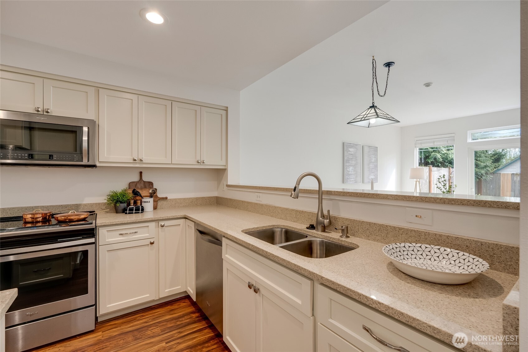 23908 Bothell Everett Highway, Unit C4 Bothell, WA 98021 - Photo 5 of 33 a kitchen with appliances a sink and cabinets