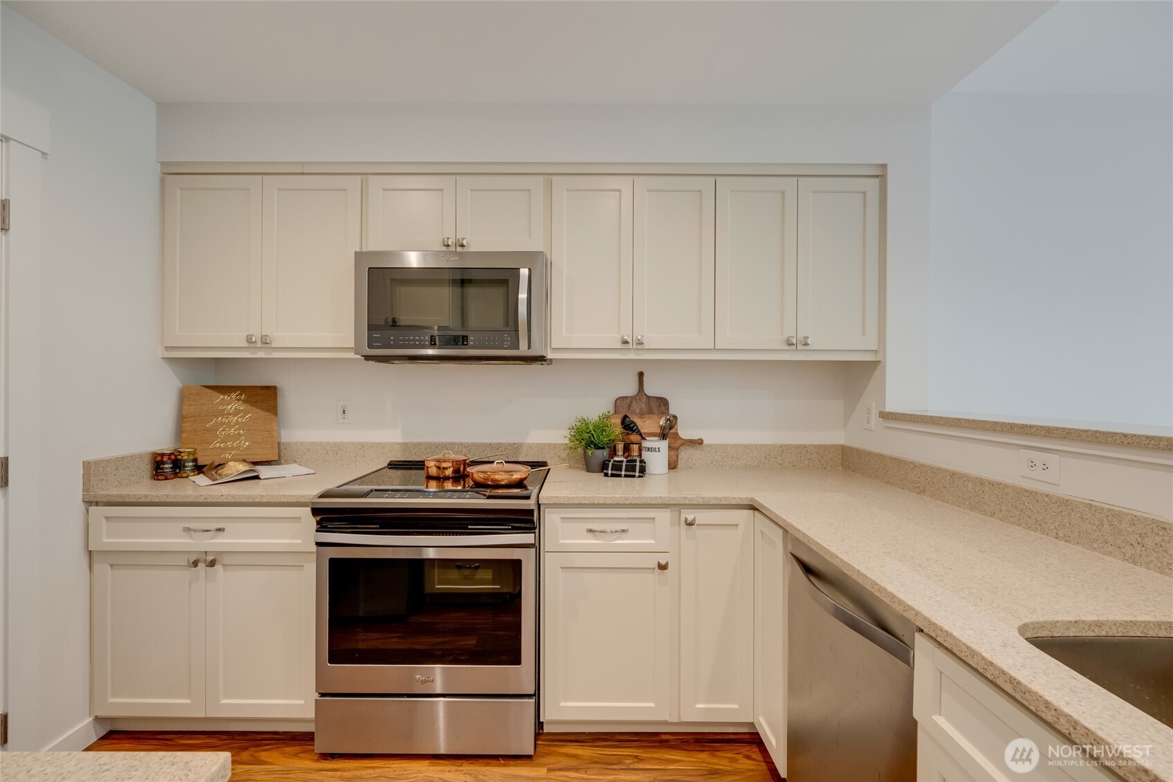 23908 Bothell Everett Highway, Unit C4 Bothell, WA 98021 - Photo 7 of 33 a kitchen with a stove and a microwave