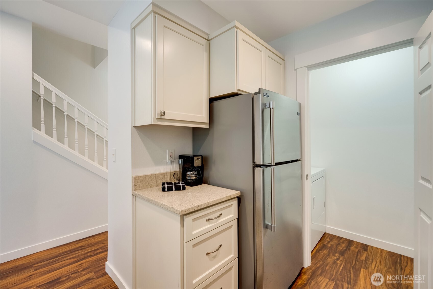 23908 Bothell Everett Highway, Unit C4 Bothell, WA 98021 - Photo 8 of 33 a room with a refrigerator and a sink