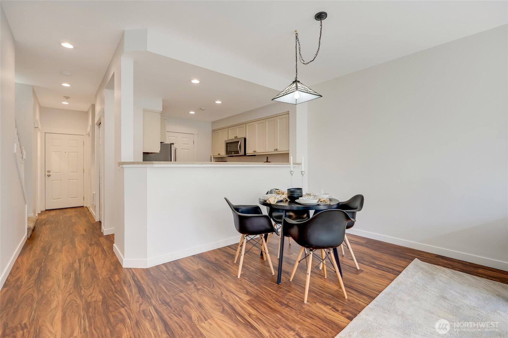 23908 Bothell Everett Highway, Unit C4 Bothell, WA 98021 - Photo 10 of 33 a dining room with furniture and wooden floor