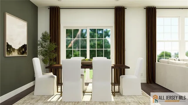 a dining room with furniture and a window