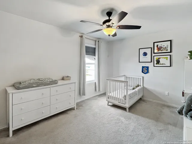 a bathroom with a double vanity sink toilet mirror and shower