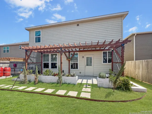 an aerial view of a house with a yard