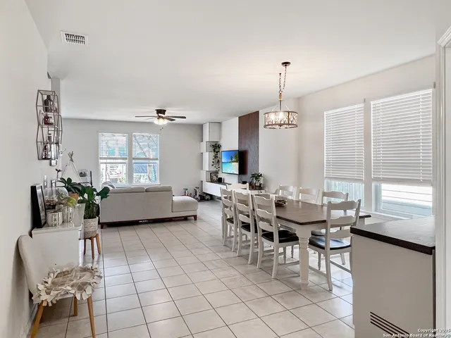 a view of a dining room with furniture and window