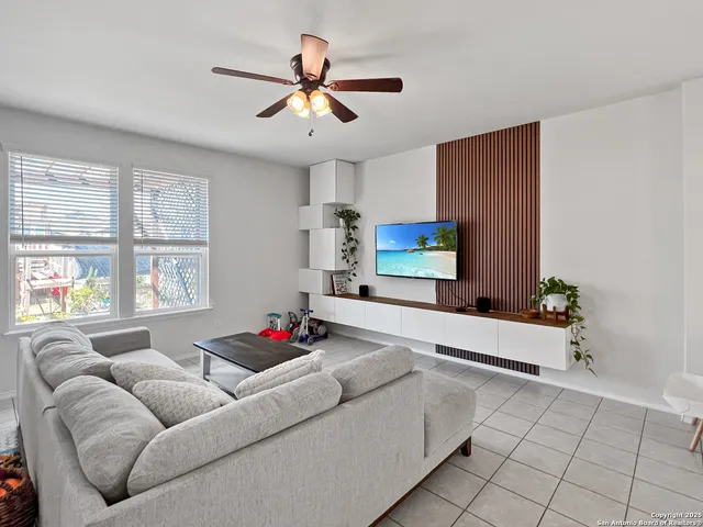 a living room with furniture and windows