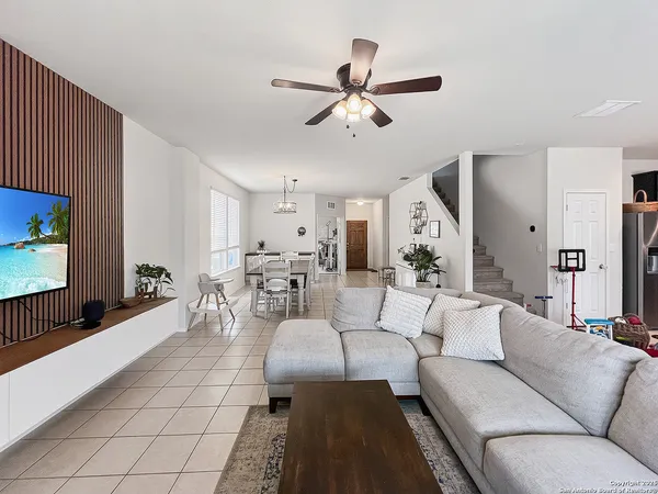 a living room with furniture and a flat screen tv