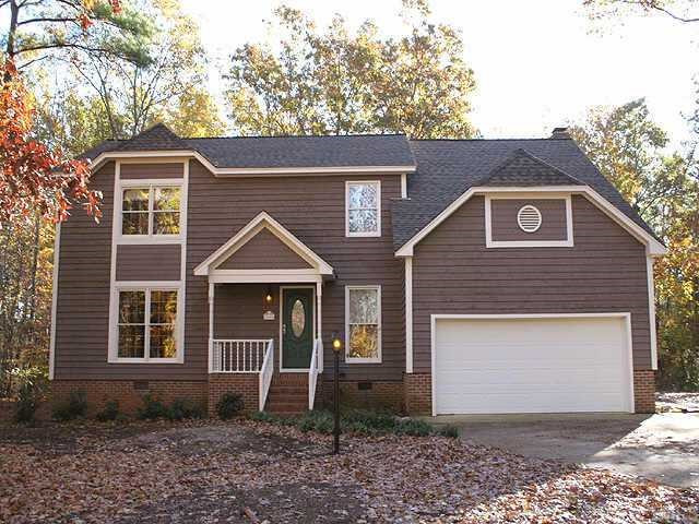 Unique two story on large cul-de-sac acre lot! Cedar exterior recently painted. Exterior Front