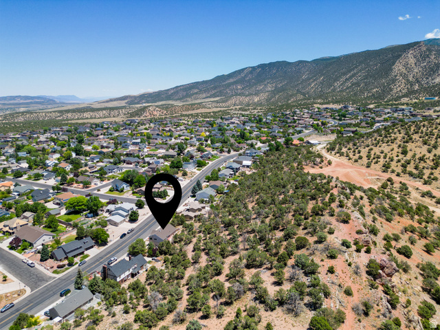 790 East Fiddlers Canyon Road Cedar City, UT 84721 - Photo 27 of 35 Expansive aerial perspective showcasing a residential neighborhood against a mountainous backdrop