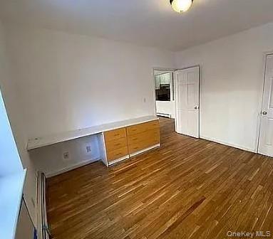 42-31 Colden Street, Unit R1A Queens, NY 11355 - Photo 6 of 9 a view of empty room with wooden floor