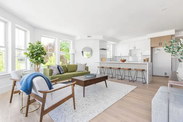 a living room with furniture and a table