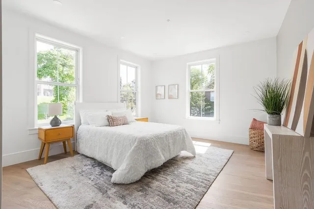 a bedroom with a large bed and a couch