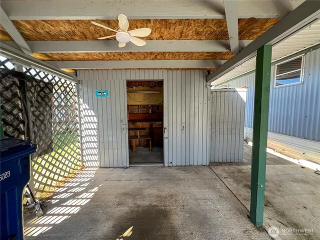 a view of entryway with a wooden door