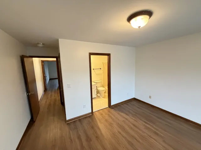 a bathroom with a sink toilet and mirror