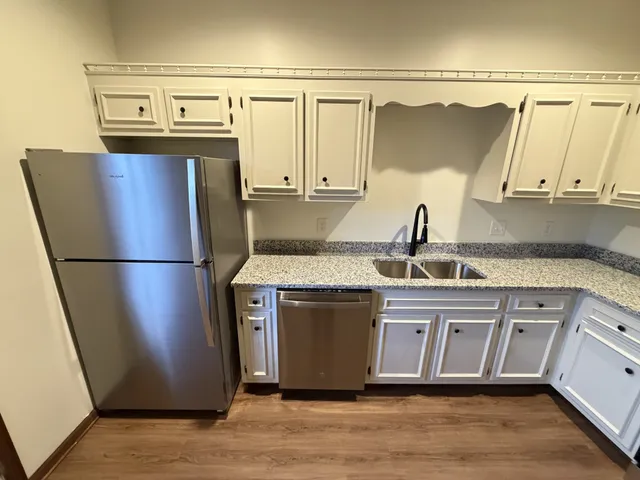 a bathroom with a sink toilet and a mirror