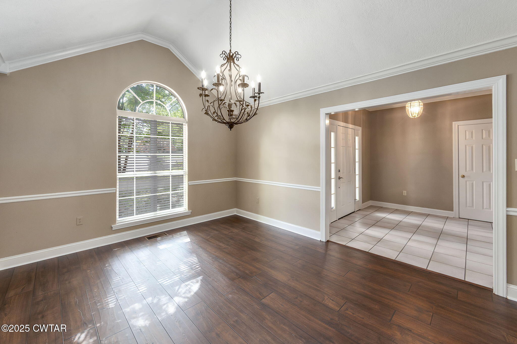 11 Deer Pointe Jackson, TN 38305 - Photo 6 of 30 an empty room with wooden floor chandelier and windows