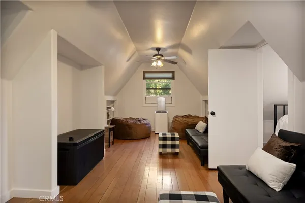 a living room with furniture rug and a window
