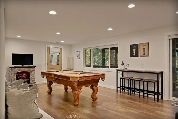 a dining room with furniture and wooden floor