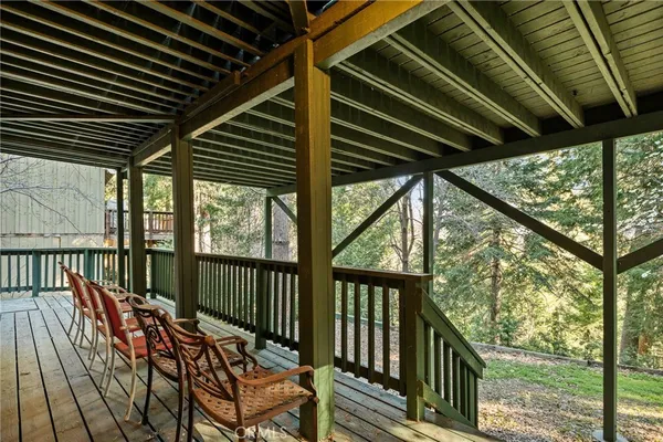 a view of a two chairs in the balcony