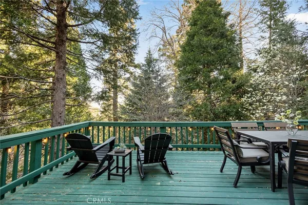 a view of a chairs and table on the deck