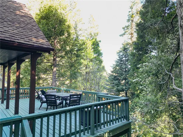 a view of a two chairs and table in the balcony