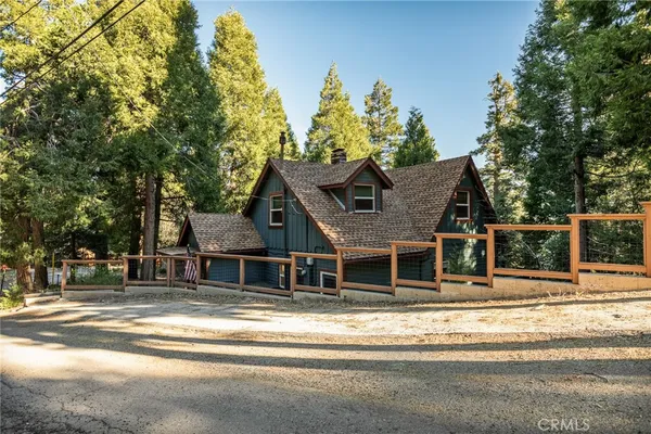 a house that has a tree in front of it