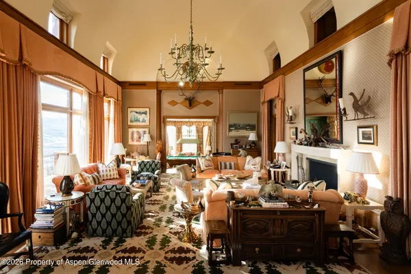 a very nice looking living room with furniture and a fireplace