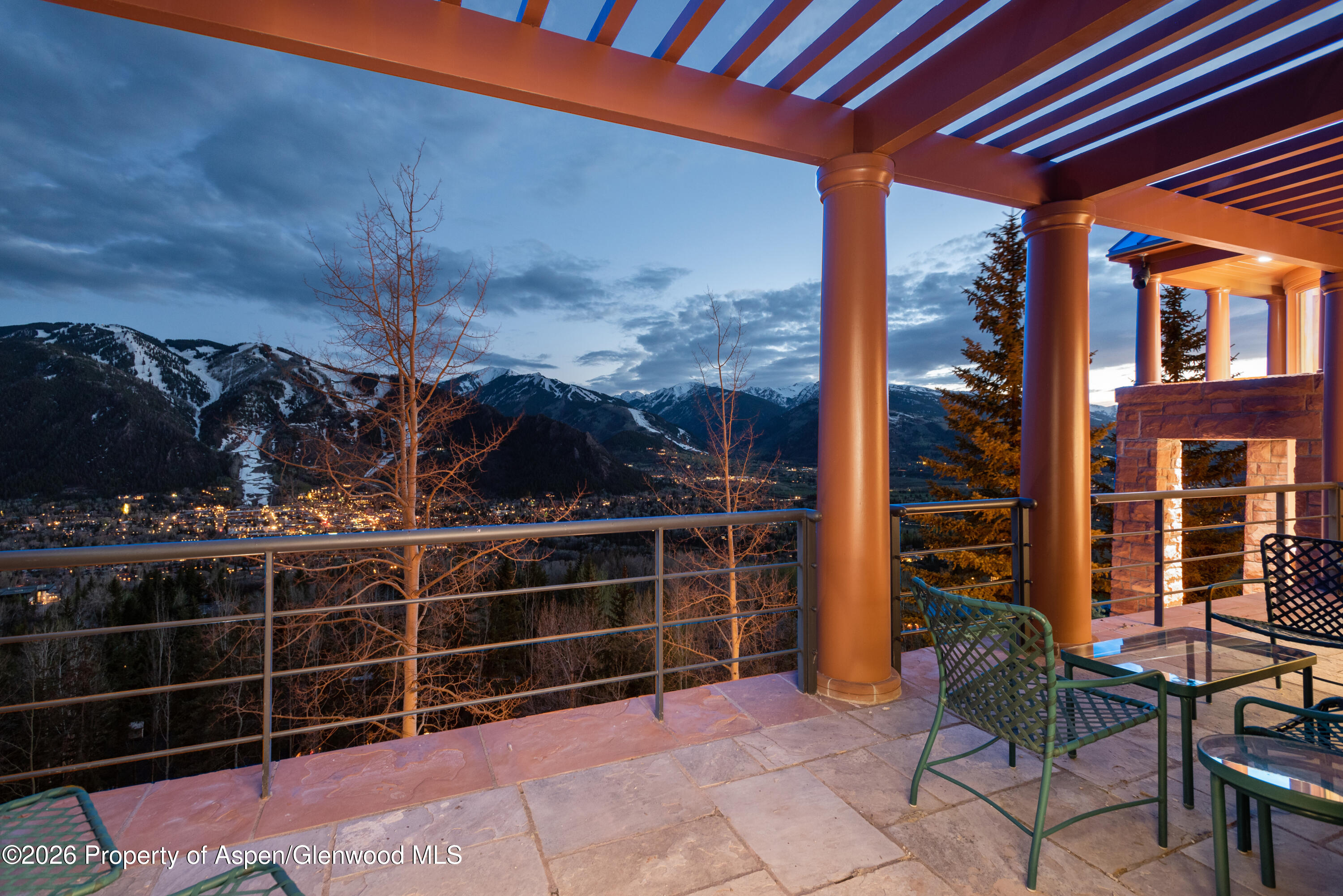 2131 Red Mountain Road Aspen, CO 81612 - Photo 20 of 31 a view of a patio with table and chairs and potted plants