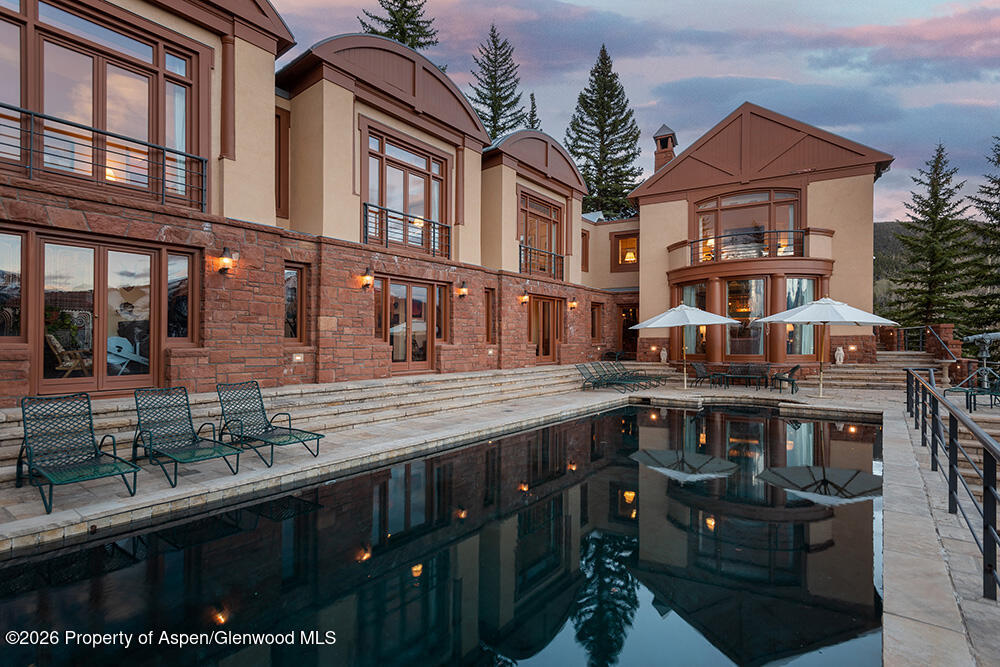 2131 Red Mountain Road Aspen, CO 81612 - Photo 28 of 31 a front view of a building with glass windows