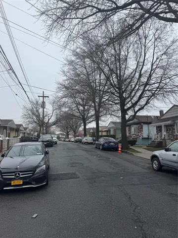 a view of cars parked on a street