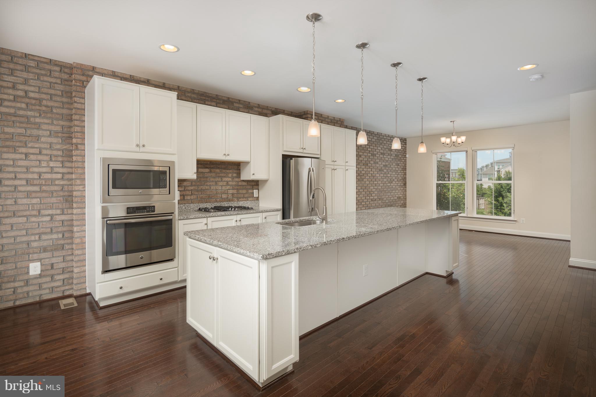 42287 Riggins Ridge Terrace Ashburn, VA 20148 - Photo 12 of 27 ISLAND WITH BREAKFAST BAR AND SEATING