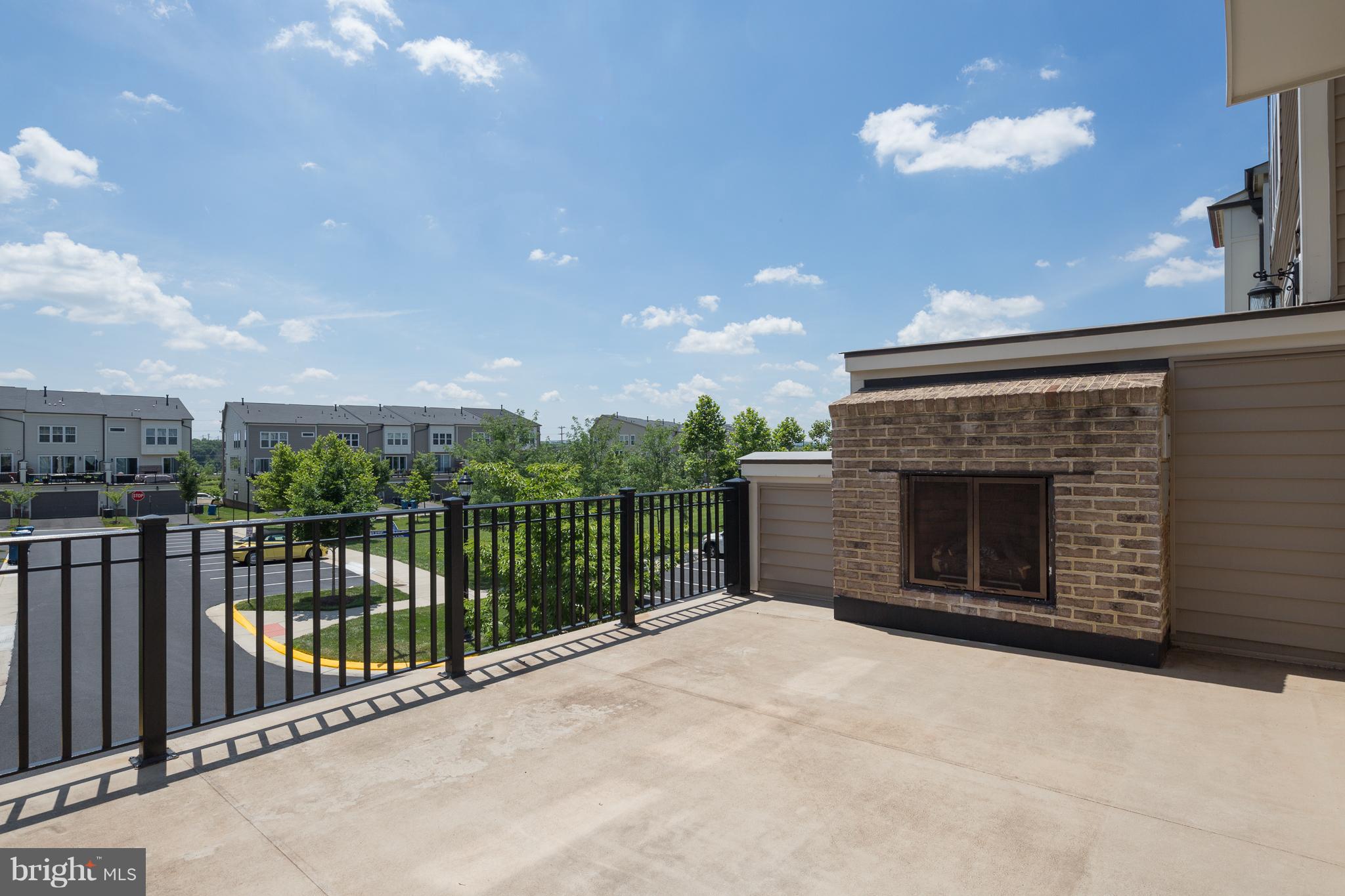 42287 Riggins Ridge Terrace Ashburn, VA 20148 - Photo 23 of 27 ENJOY OUTDOOR BALCONY WITH FIREPLACE