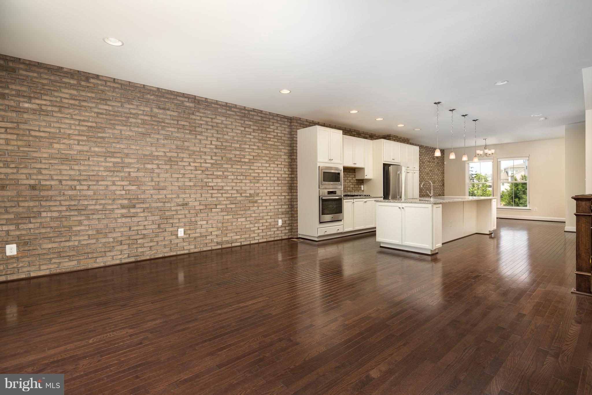 42287 Riggins Ridge Terrace Ashburn, VA 20148 - Photo 9 of 27 FAMILY ROOM-KITCHEN DINING ROOM-OPEN PLAN
