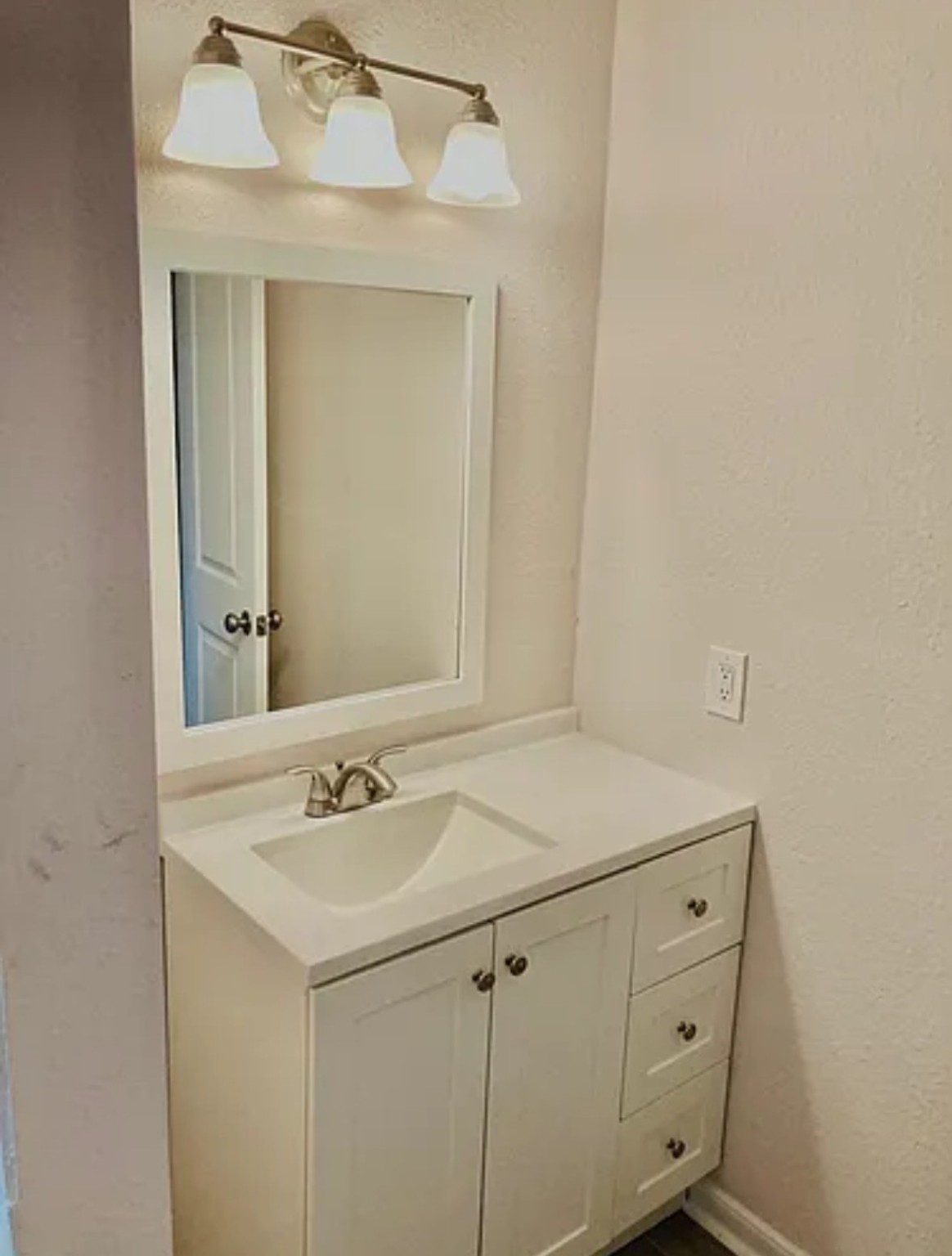 7339 Mountbatten Road Houston, TX 77033 - Photo 7 of 33 a sink with a mirror