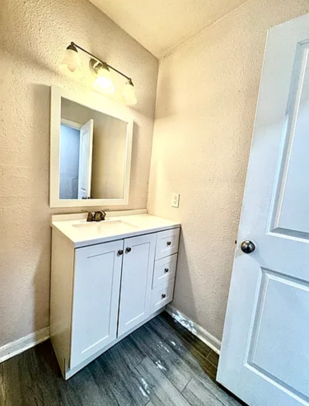 7339 Mountbatten Road Houston, TX 77033 - Photo 9 of 33 a spacious bathroom with a double vanity sink and mirror