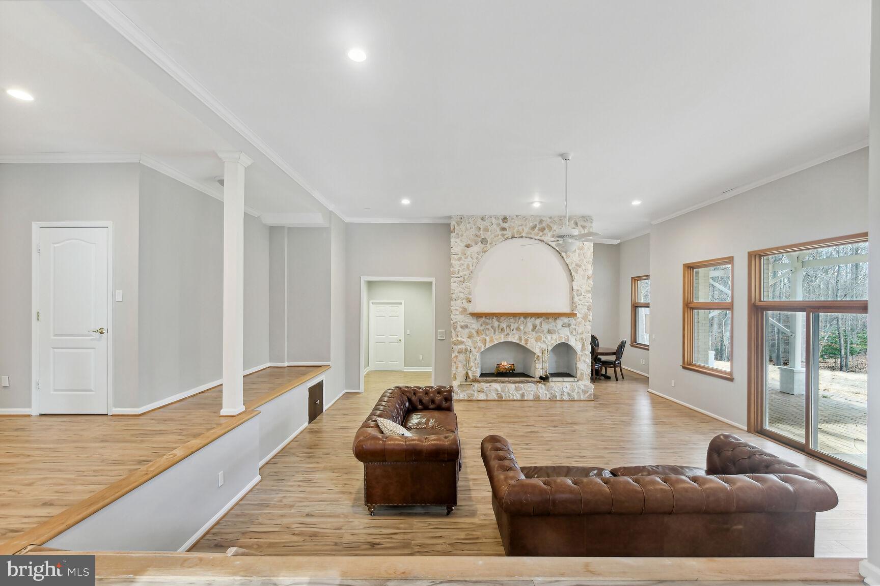 209 River Bend Road Great Falls, VA 22066 - Photo 37 of 44 a living room with furniture large window and a table