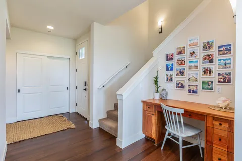 a kitchen with a sink and a mirror