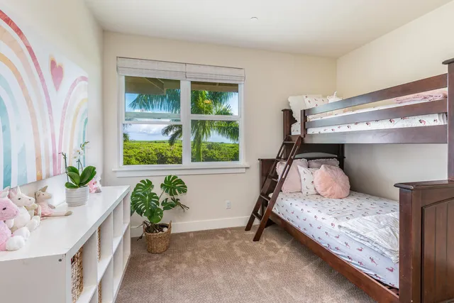a bedroom with a bed and a flat screen television