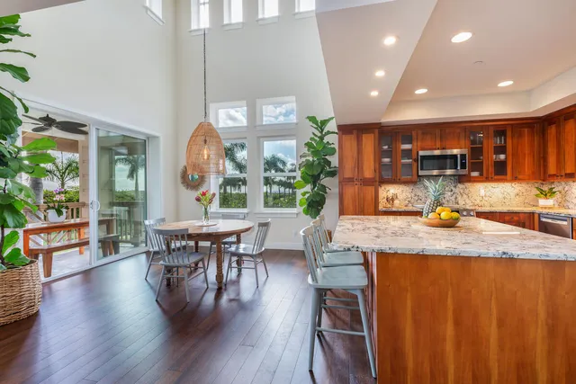 a dining room with furniture window and wooden floor