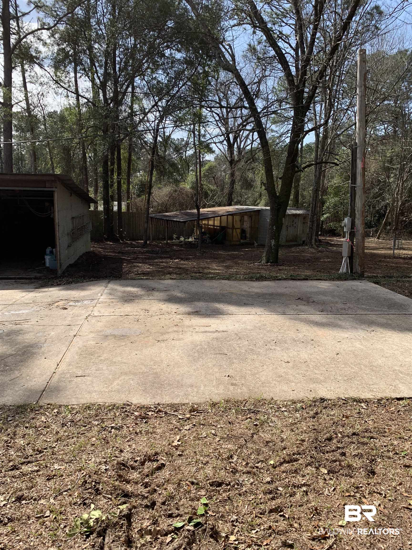 15575 Rogers Drive Chunchula, AL 36521 - Photo 40 of 42 View of yard with an outdoor structure