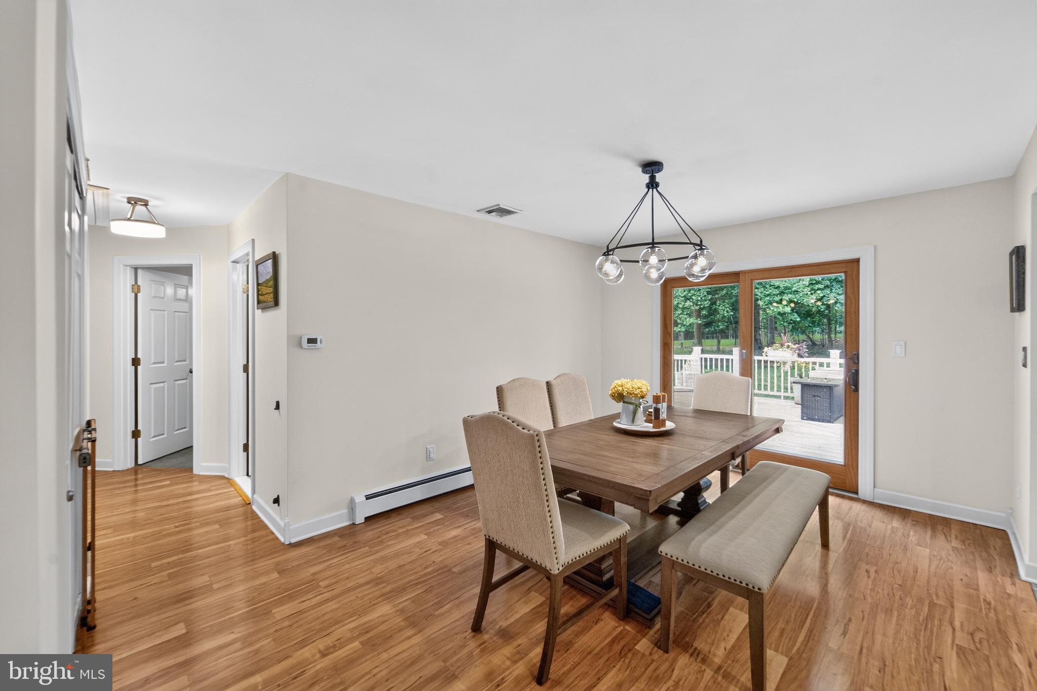 338 Woolf Road Milford, NJ 08848 - Photo 8 of 24 Bright dining space with outdoor access.
