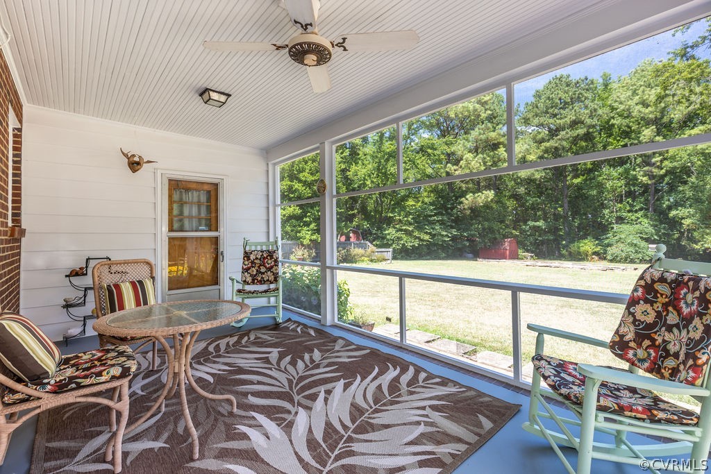 558 Broad St Road Manakin-Sabot, VA 23103 - Photo 27 of 42 a living room with furniture and a large window