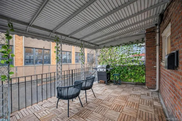a view of a livingroom with furniture and a flat screen tv
